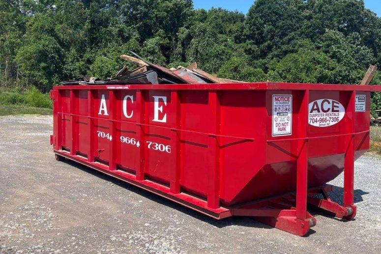 Red dumpster rental from Waste Universe